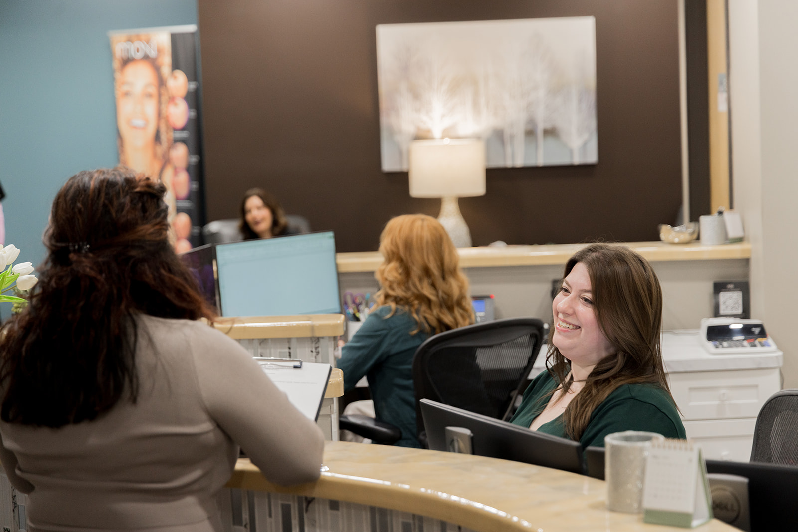 a client checking at a medical laser center